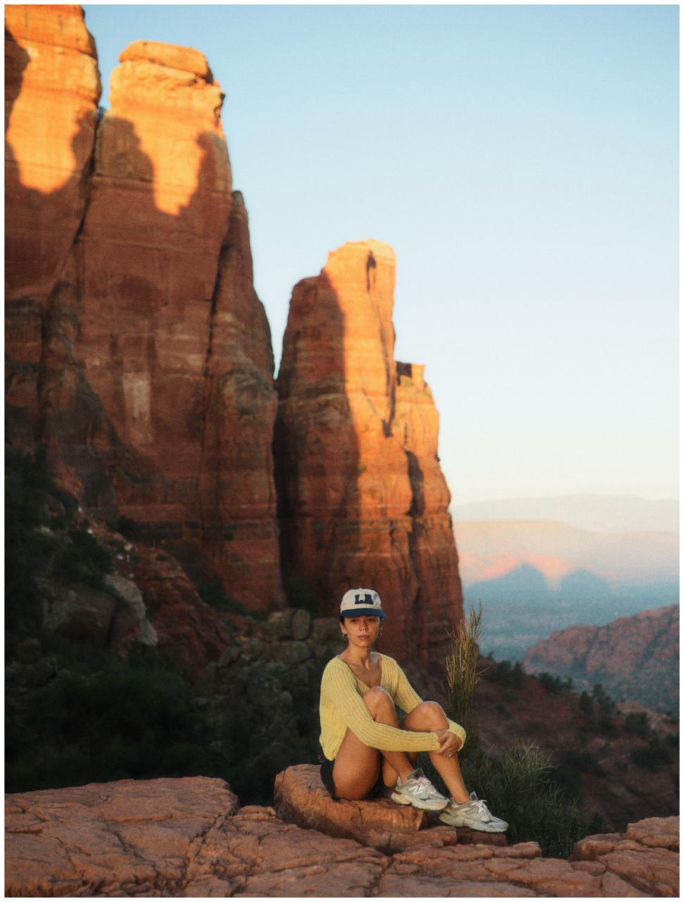 Raya sitting on a rock in Sedona