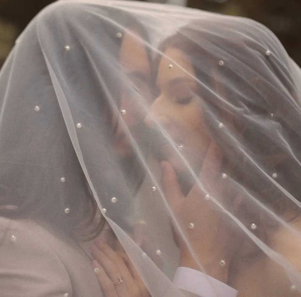 Wedding couple under a veil
